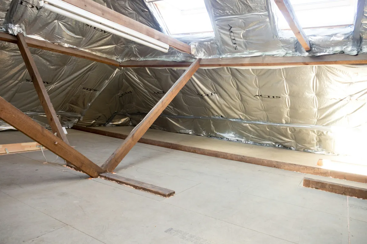 Loft with thick mineral wool insulation laid between the joists