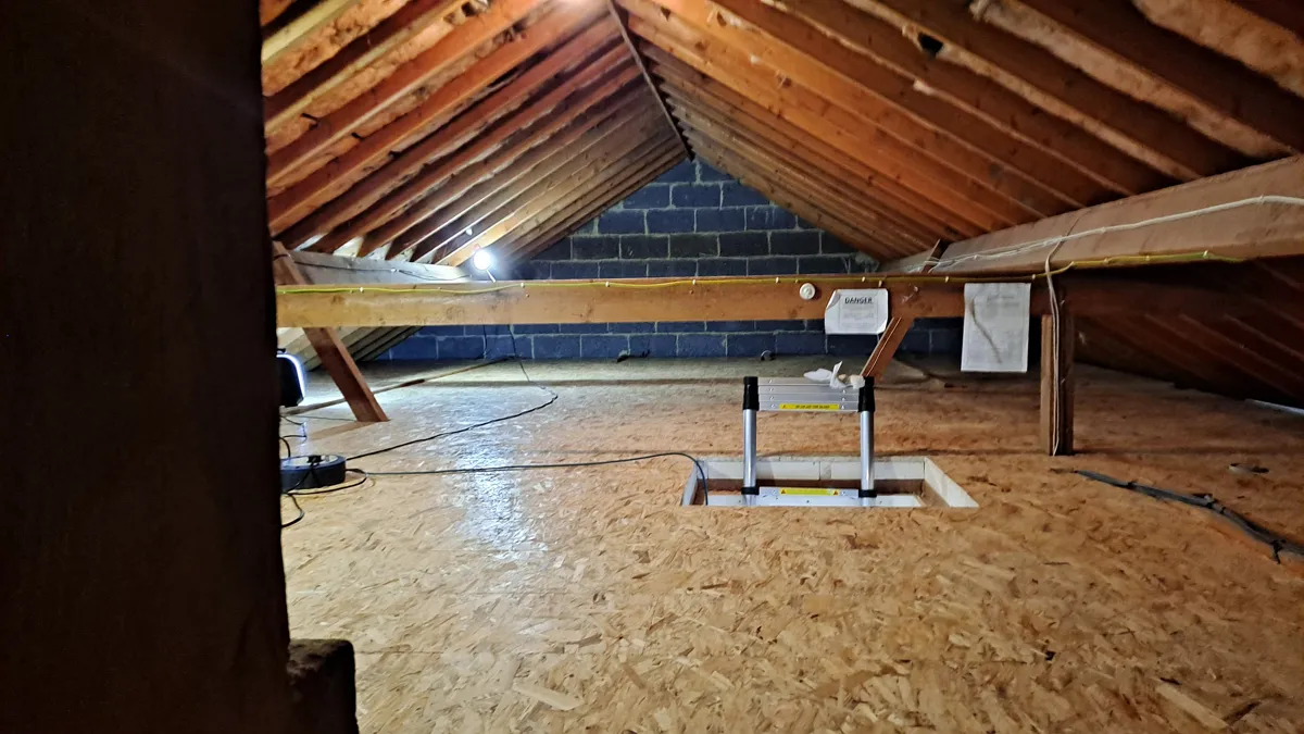 Raised loft boarding fitted over thick loft insulation